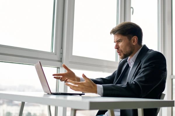 Person getting annoyed at their computer